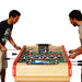 2 players playing on a Bonzini B60 foosball table